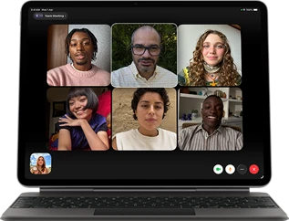 iPad Air, attached to Magic Keyboard, Black color, Group FaceTime call on screen