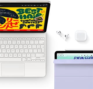 iPad Air, Starlight color, colorful graphics on screen, attached to Magic Keyboard, Airpods Pro and Apple Pencil Pro accessories