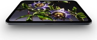 iPad mini, 8.5-inch OLED display, bright and deep blacks, showing a person wearing a hat and jacket