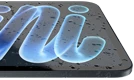 iPad mini, showcasing water droplets on a screen
