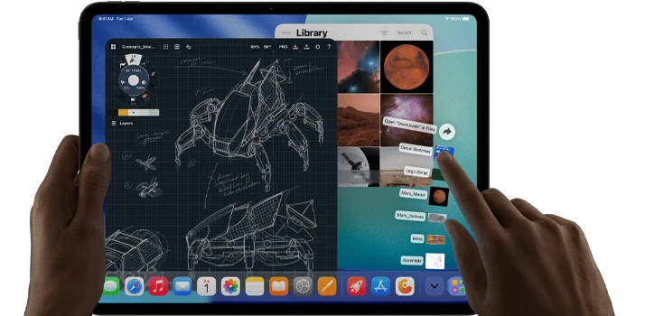 iPad Pro, space black color, left hand holding device, right hand pointing gesturing to manipulate multiple open app windows, a drawing app with sketches of mechanical designs, photos library of planets and space images, downloads folder files fanned out