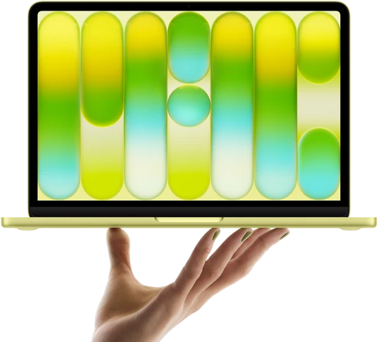 MacBook Neo in citrus color, balanced on fingertips of open hand, screen displaying colorful abstract pattern