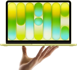 MacBook Neo in citrus color, balanced on fingertips of open hand, screen displaying colorful abstract pattern